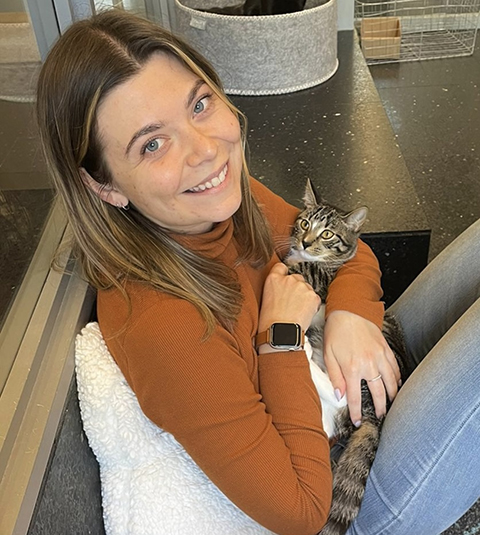 Frances Smith regularly does some self-care by snuggling up with furry residents at a cat café.