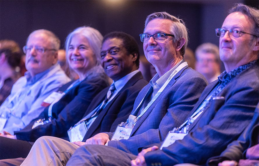Robert Haltiwanger, second from right, enjoys a presentation at Discover BMB, the 2023 ASBMB meeting in Seattle with, from left, Gerald Hart, a University of Georgia colleague and 2018–2020 ASBMB president; Tony Antalis, 2020–2022 ASBMB president; James Ntambi, ASBMB Council member; and Alex Toker, editor-in-chief of the Journal of Biological Chemistry.