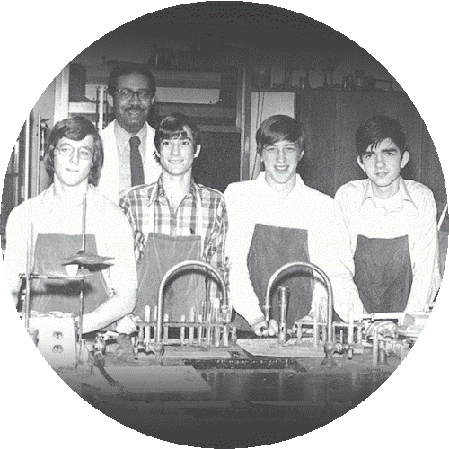Michael Snyder (second student from left) credits his advanced chemistry teacher, Mr. Darby (back row), with giving him the freedom to explore science through independent research projects. Michael Snyder in 9th grade