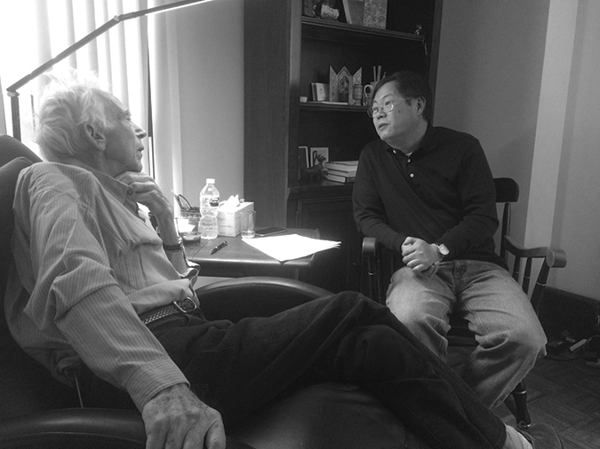 Tom August talks with Johns Hopkins colleague Yadong Wei
