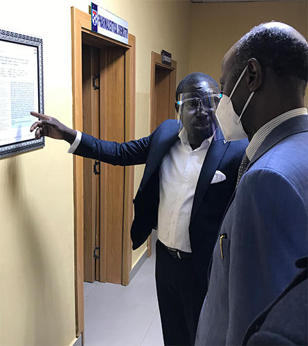 Omotuyi gives E.S. Bogoro, executive secretary of Nigeria's Tertiary Education Trust Fund, a tour of the Institute for Drug Research and Development at Afe Babalola University.