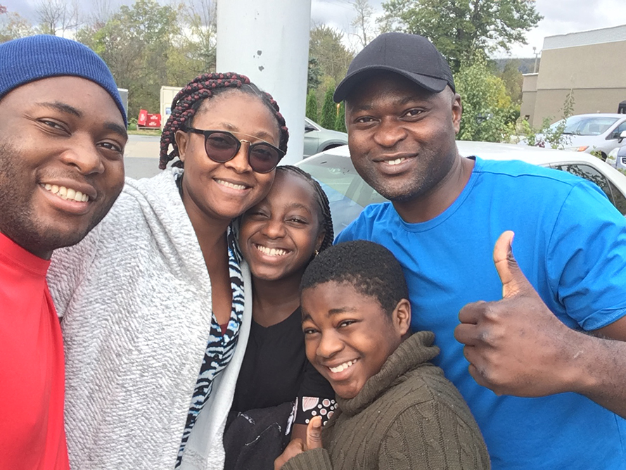 René Fuanta with his older brother Serge, sister-in-law Hilda, niece Favour and nephew Charles.