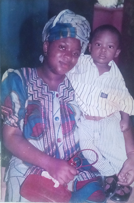 Victor Nweze and his mother at an event in Lagos State, Nigeria, when he was 2 years old. She died when he was 10.