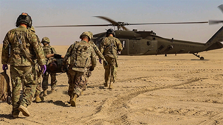 A helicopter-based U.S. Army paramedic team, like this one shown in training in Kuwait in 2018, brought Rory Stuart’s patient from a remote outpost to Bagram Air Base. The flight was not without risk for the pilots and crew, Stuart said.