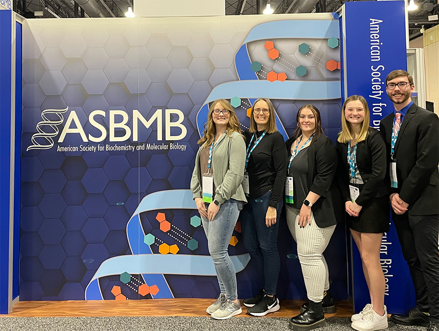 Bonnie Hall (second from left) strikes a pose at the ASBMB annual meeting in Philadelphia with students Sarah Jordan, Brooklyn Mills, Isabelle Juhler and Lucas Kramer.