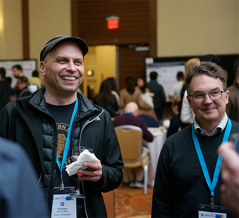 Enrique De La Cruz socializes with other scientists at an ASBMB annual meeting which he describes as “one of the most valuable national conferences you can attend.”
