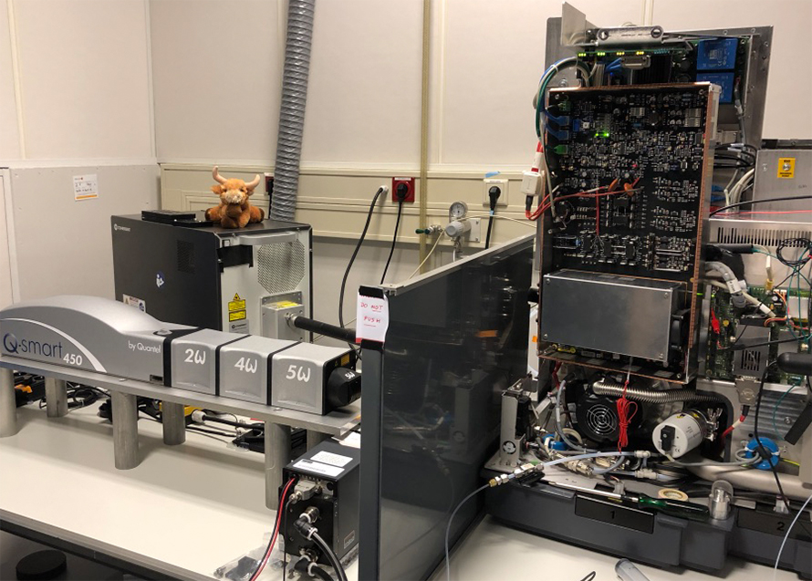 A plush toy cow sits atop a mass spectrometer in Albert Heck's lab.