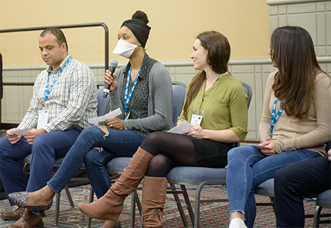 MOSAIC scholar Chelsey Spriggs (with microphone) speaks at the 2022 ASBMB Annual Meeting while panelists and fellow scholars (from left) John Jimah, Josefina Inés de Mármol and Alfa Herrera listen.