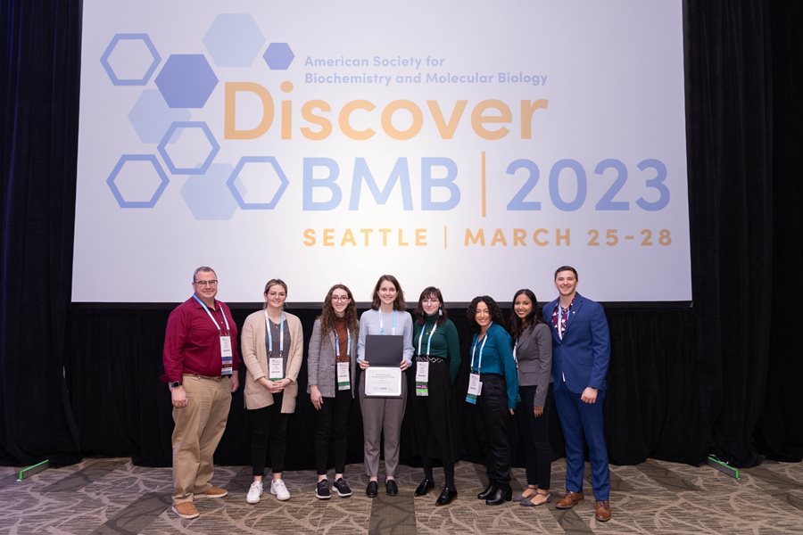 Otterbein University, 2023 Outstanding Chapter. Pictured L–R: John Tansey (faculty adviser), Savanna Glass, Kaitlin Dean, Olivia Miller, Mara Shields, Olivia Brickey, Ashni Patel and Mason Nolan.