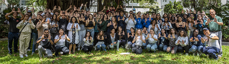 Organizers from the University of Miami and participants from local high schools pose for a group portrait during the crime scene DNA investigation outreach event.