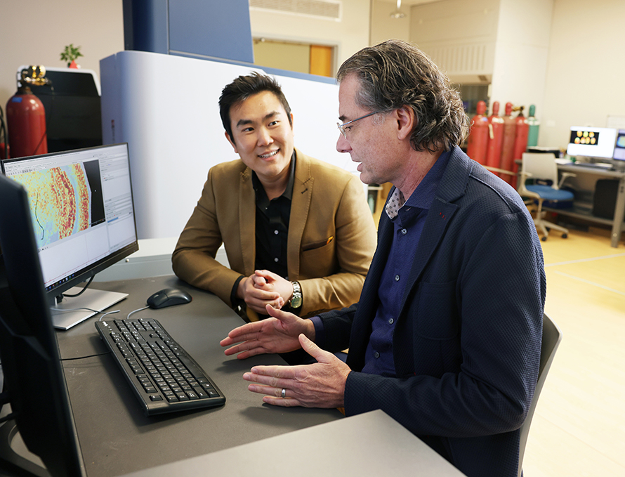 Matt Gentry, a professor and chair of biochemistry and molecular biology at the University of Florida, and collaborator Ramon Sun, associate professor at University of Florida department of biochemistry and molecular biology and director of the University of Florida Center for Advanced Spatial Biomolecule Research, discussing the results of a collaborative spatial imaging project.