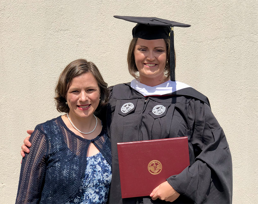 Katie Sandlin and her PI, Laura Reed, at Sandlin’s master’s graduation ceremony.