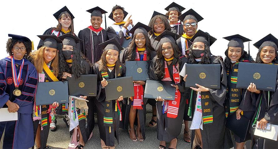 Stoddard, at left, celebrates with the first graduates of the STEM Cohort Mentoring Program she spearheaded in 2017.