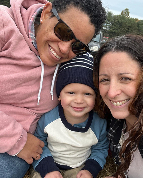 Donita Brady (left) pose with her son Barnett Brady (center) and wife Leigh Ronnan (right) on a hayride at Linvilla Orchard in Pennsylvania.