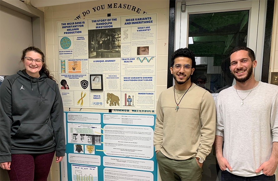 Junior Amy Stewart and seniors Ramzi Jaadan and Omar Aref show off their MC1R posters.
