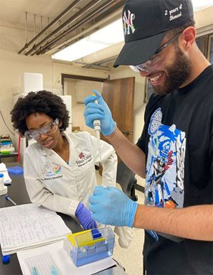 Time spent in lab: Shana Stoddard and undergraduate student Darius Swift work on an experiment together.