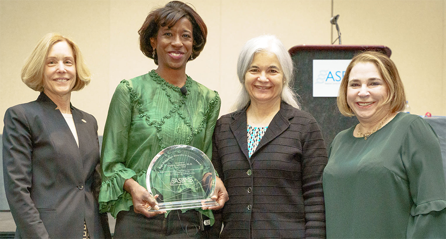 Ann Stock (left) and Sonia Flores (right) are pictured with Tracy Johnson, recipient of the 2022 Ruth Kirschstein Diversity in Science Award, and past president Toni Antalis at the ASBMB 2022 annual meeting in Philadelphia. The Maximizing Access Committee selects the winner of this award.