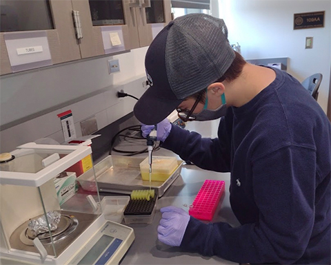Cass Conray works in the lab at the University of Central Oklahoma.