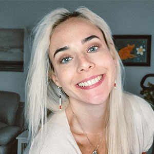 Monica Pruitt, a young blond white woman, smiles for a selfie picture.