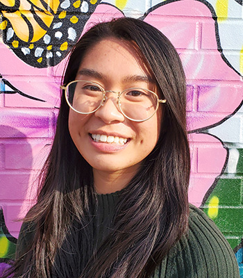 Portrait of Arden Bui with painted flower background