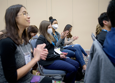 MOSAIC scholars Elizabeth Wasmuth (left), Cassandra Hayne, Chelsey Spriggs and Alfa Herrera applaud during a panel discussion at ASBMB’s 2022 annual meeting.