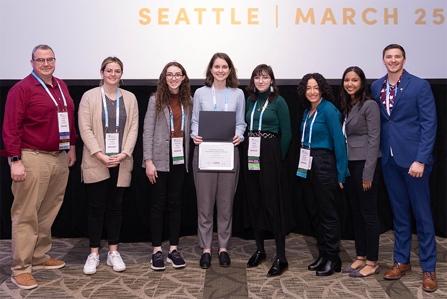 John Tansey, left, and Otterbein Student Chapter members Savanna Glass, Kaitlin Dean, Olivia Miller, Mara Shields, Olivia Brickey, Ashni Patel and Mason Nolan were honored at Discover BMB, the ASBMB 2023 annual meeting in Seattle.