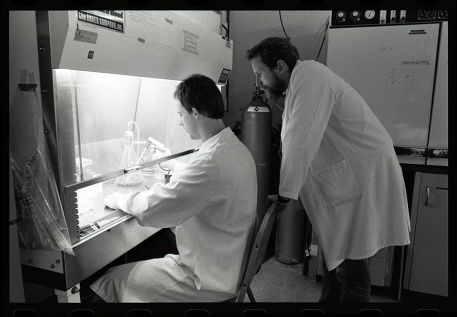 Charles Rice (right) with a coworker at Washington University in 1989, the year that Michael Houghton, from Chiron Corporation, reported a novel form of hepatitis using genetic material obtained from blood samples of hepatitis patients. It remained uncertain whether the newly discovered virus truly was the cause of non-A, non-B hepatitis, as it was called, until 1997, when Rice and his colleagues managed to culture the virus and showed that the virus alone could cause the disease. In 2020, Houghton, Rice and Harvey J. Alter received the 2020 Nobel Prize in Physiology or Medicine for the discovery of hepatitis C virus.