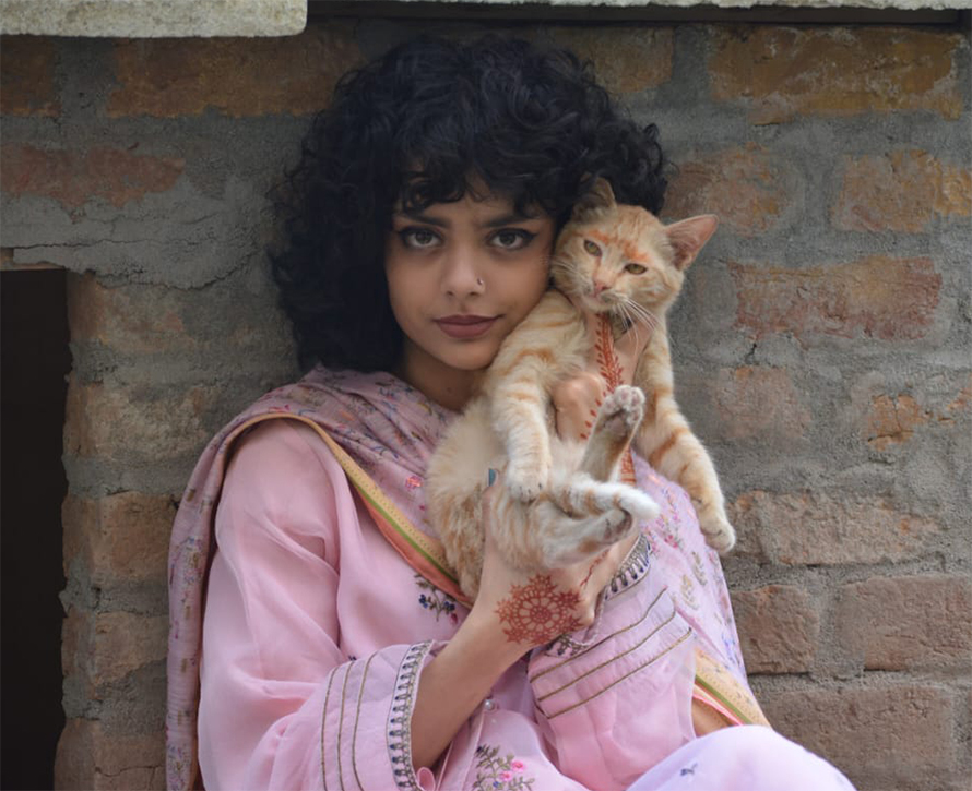 As an adult, the author said, Zehra possesses a compassionate heart and a great love for nature. In this image, she cradles an orphan kitten that she rescued.