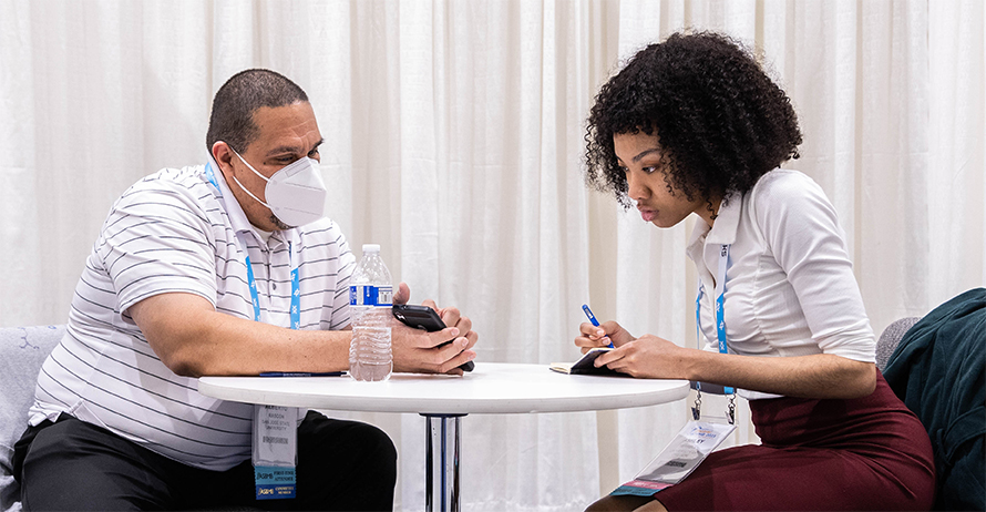 Alberto A. Rascón (left), an associate professor at Arizona State University and a member of the ASBMB Maximizing Access Committee, has a one-on-one mentoring session with Ashley Terrell, a research assistant at the University of Oregon, at Discover BMB 2023 in Seattle.
