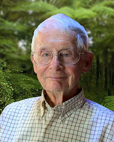 Portrait of Guy Thompson with plants