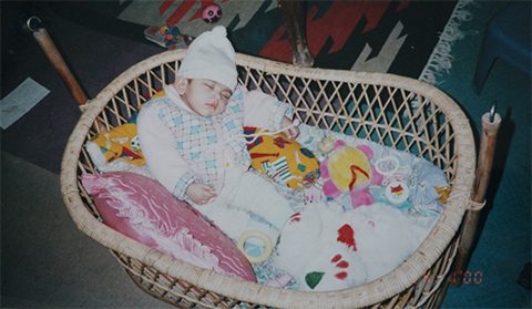 Baby Zehra in her crib at home in January 2000 after pulmonary artery surgery.