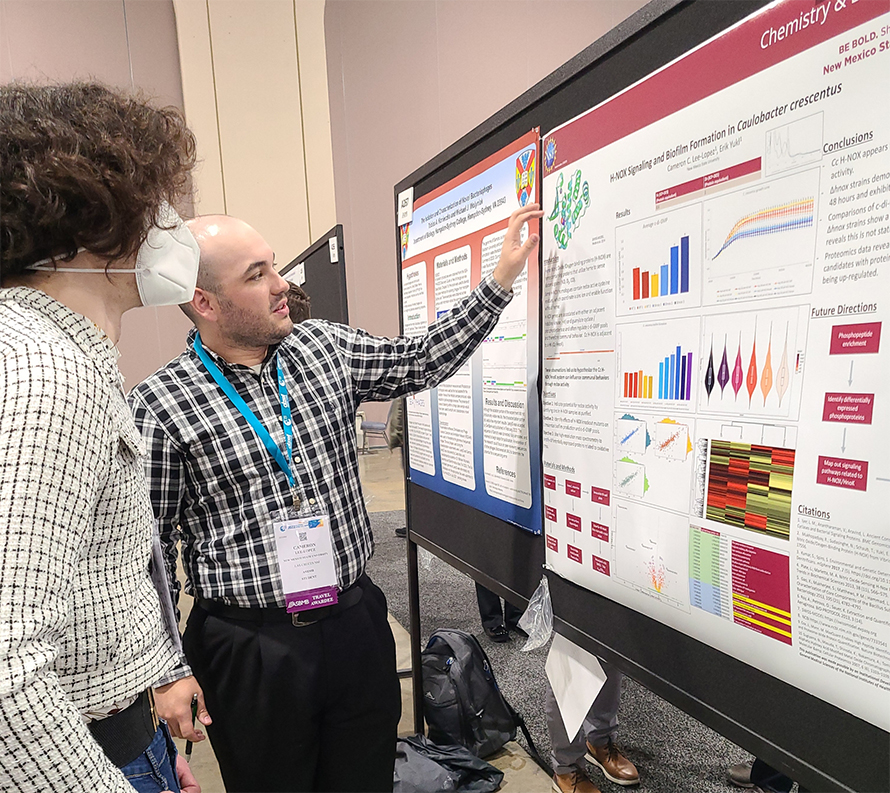 Cameron Lee–Lopez discusses his work with a visitor to the poster hall at the 2022 ASBMB meeting in Philadelphia.