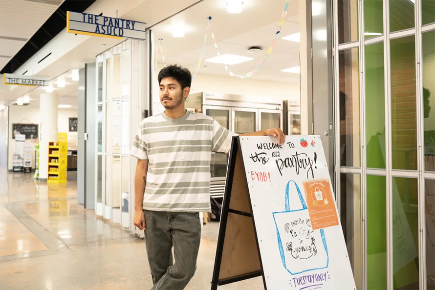 Sergio Bocardo-Aguilar, at the University of California, Davis, outside the campus food pantry. In his first year, Bocardo-Aguilar worked part time but fell just short of the cutoff to get federal food stamps.