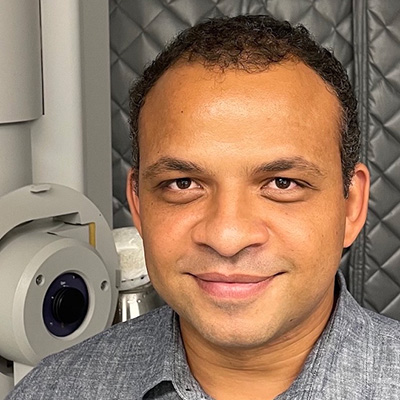 lab portrait of John Jimah with equipment