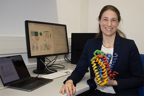 Franziska Heydenreich, PhD, from the University of Marburg, the lead and co-corresponding author, holding a structure of a G protein-coupled receptor.