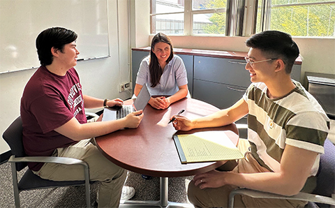 Sara Brownell, professor of biology at Arizona State University, center, catches up with students Ren Dixon and Vincent Truong in early 2023.