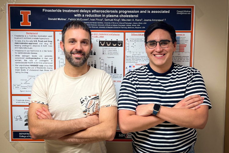 Jaume Armangual and Donald Molina Chaves in front of their poster